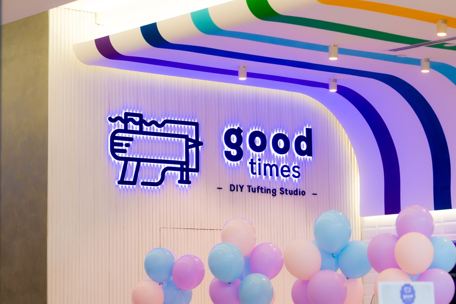 The Good Times DIY Tufting Studio neon sign with balloons