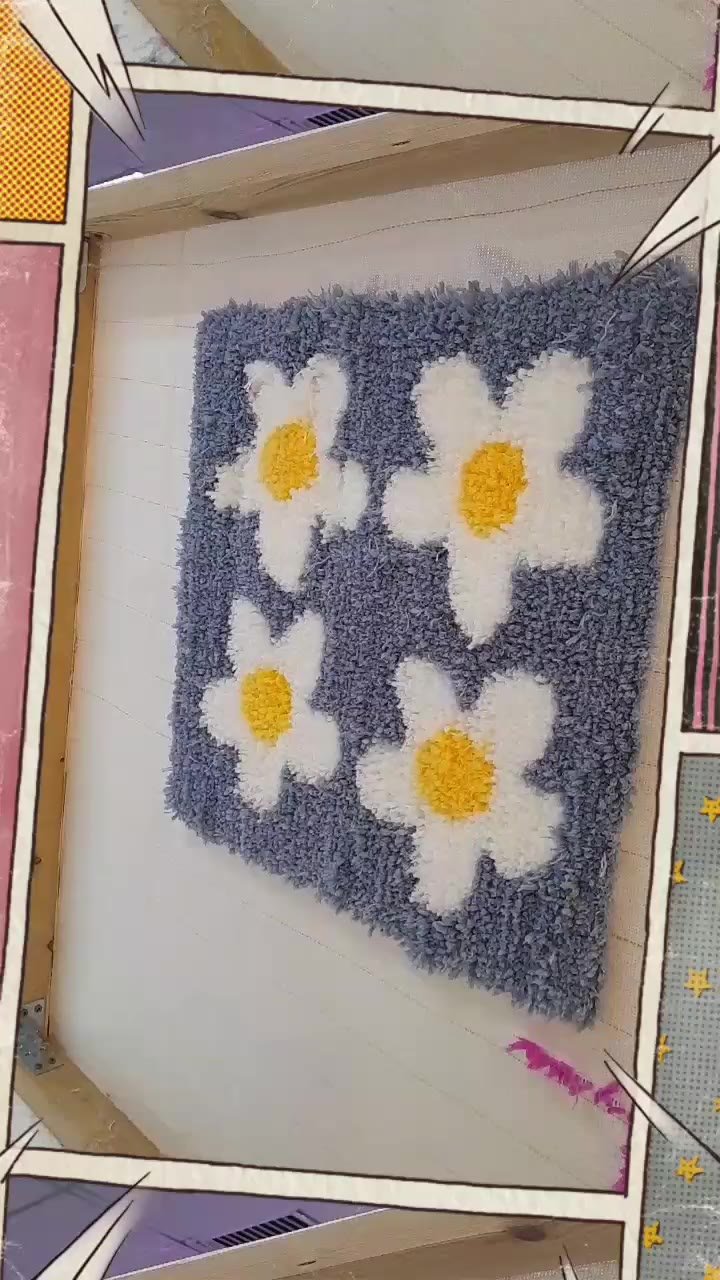 A tufted rug with white flowers on a blue background